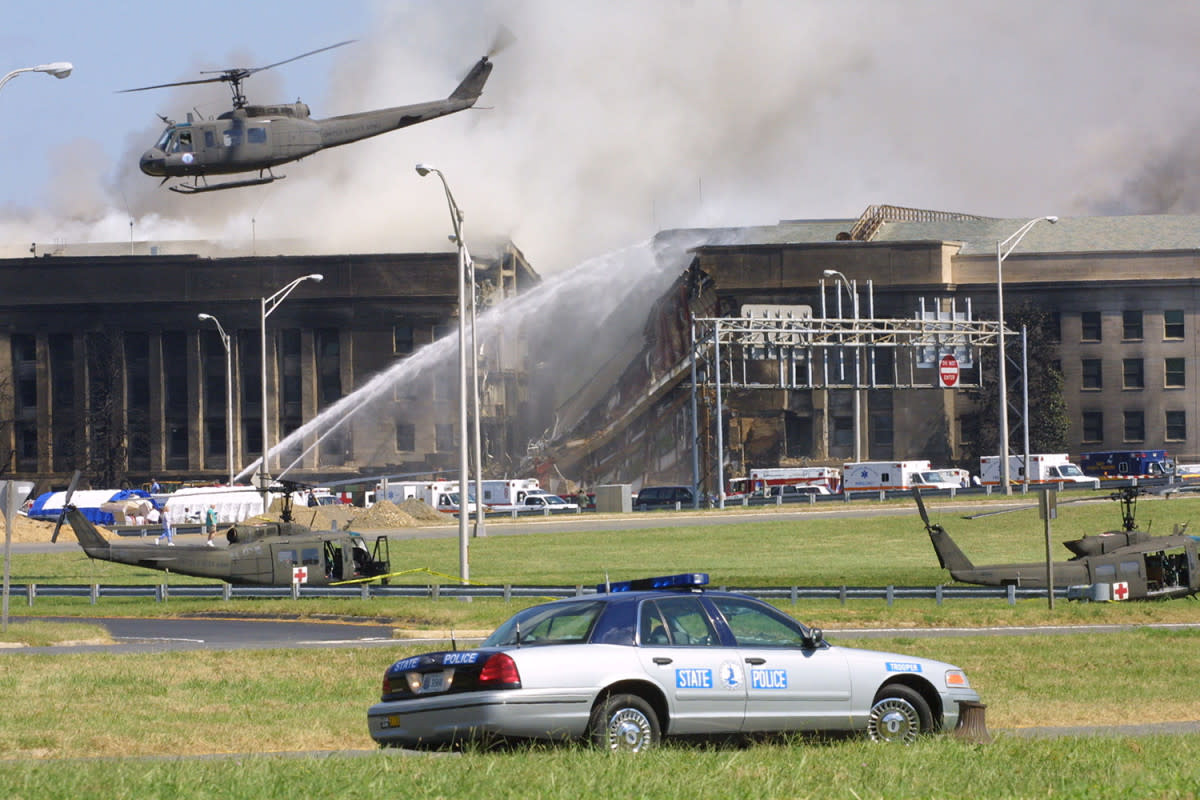 <p>Alex Wong/Getty Images</p><p>Smoke comes out from the Southwest E-ring of the Pentagon building after a plane crashed into the building and set off a huge explosion. </p>