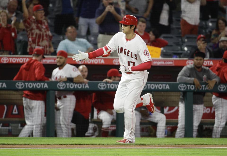 Los Angeles Angels' Shohei Ohtani, of Japan, celebrates after his home run against the Texas Rangers during the first inning of a baseball game in Anaheim, Calif., Monday, Sept. 24, 2018. (AP Photo/Chris Carlson)