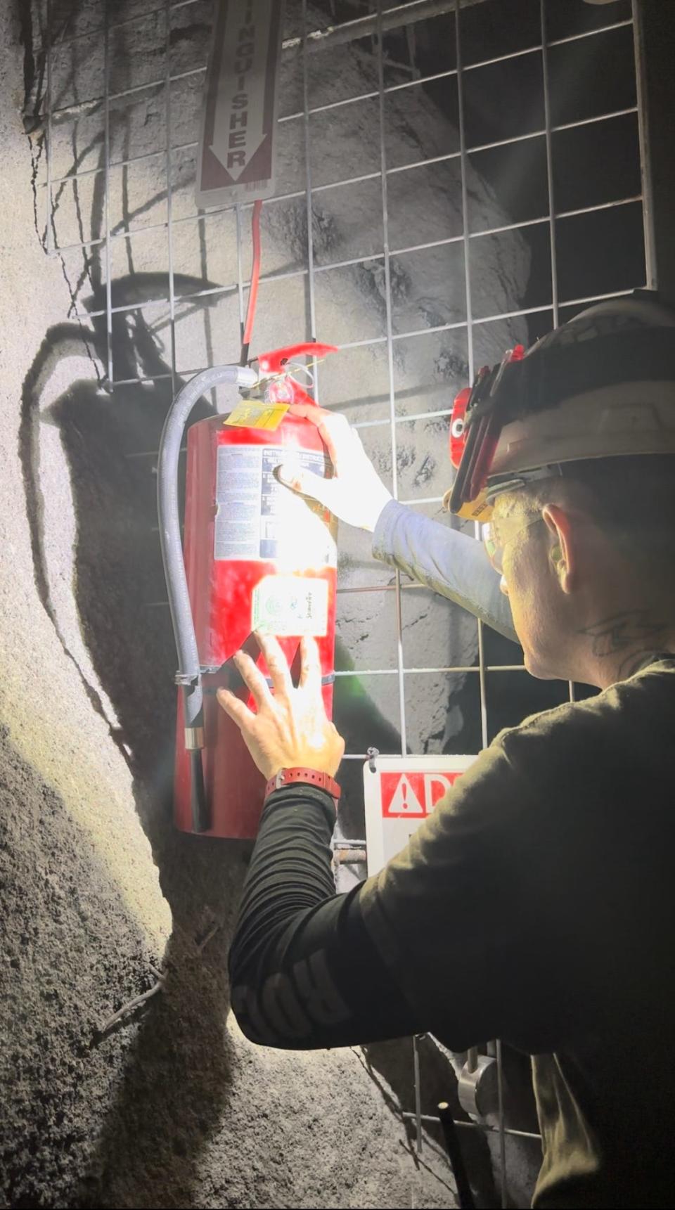 cory rockwell inspecting fire extinguishers