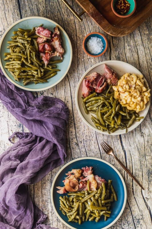 <p>Sweet Tea and Thyme</p><p>These flavorful and tender green beans have been a Southern staple for generations. Slow-cooked in a vitamin-rich broth with smoked meat, this cultural side dish is on every Southern holiday table!</p><p><strong>Get the Recipe:</strong> <strong><a href="https://www.sweetteaandthyme.com/easiest-slow-cooked-southern-green-beans/" rel="nofollow noopener" target="_blank" data-ylk="slk:Authentic Southern Green Beans;elm:context_link;itc:0;sec:content-canvas" class="link rapid-noclick-resp">Authentic Southern Green Beans</a></strong></p>