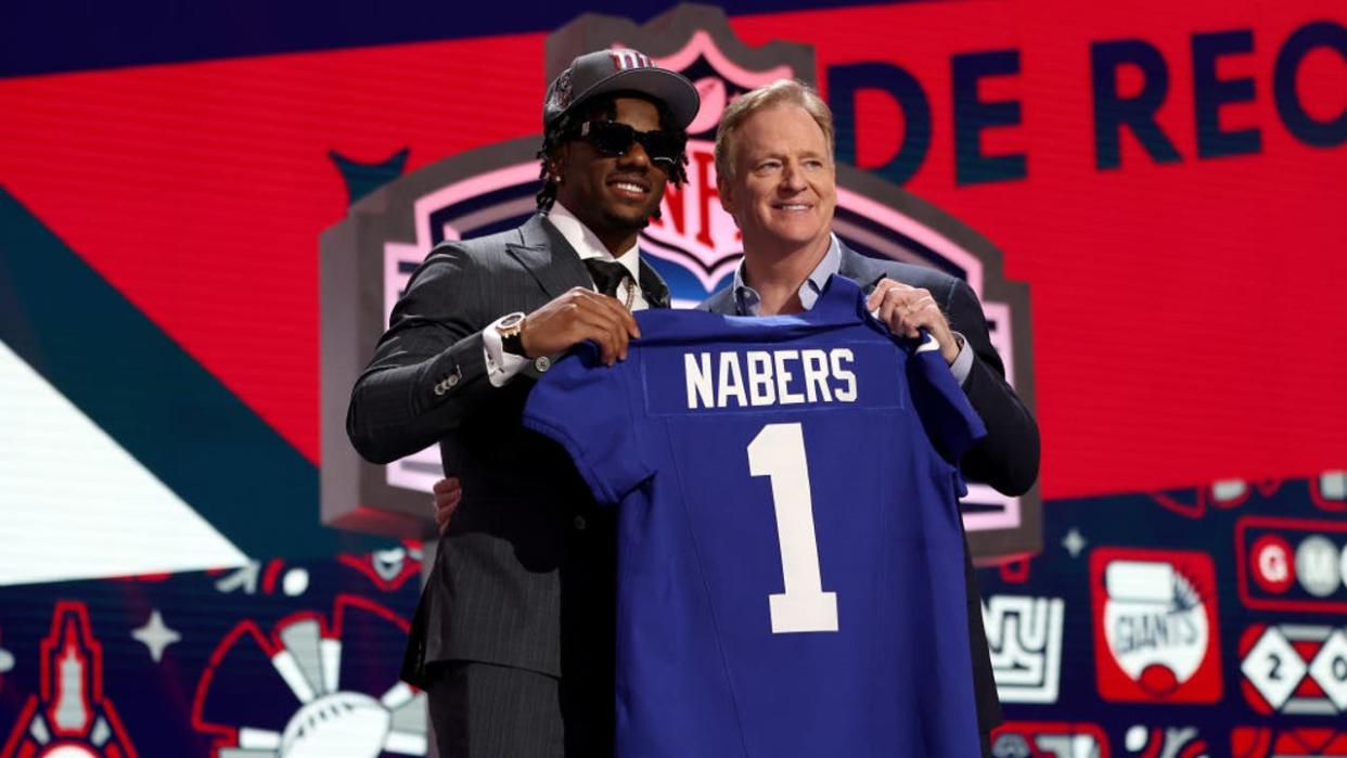 <div>DETROIT, MICHIGAN - APRIL 25: (L-R) Malik Nabers poses with NFL Commissioner Roger Goodell after being selected sixth overall by the New York Giants during the first round of the 2024 NFL Draft at Campus Martius Park and Hart Plaza on April 25, 2024 in Detroit, Michigan. (Photo by Gregory Shamus/Getty Images)</div>