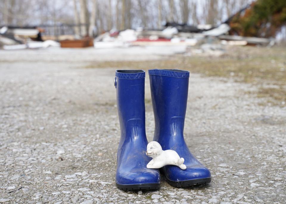 These boots and figurine were salvaged from the fire at the Dalton family's home on Nov. 1, 2022. Tthe boots were blown out of the back of the house by the explosion, and the figurine was found in the debris.