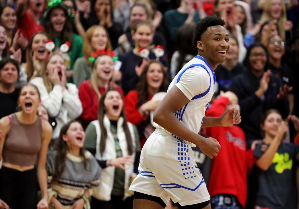 CVCA guard Darryn Peterson is all smiles after throwing down a dunk as the student section goes wild during the second half of a basketball game against Canton South, Friday, Dec. 16, 2022, in Cuyahoga Falls, Ohio.