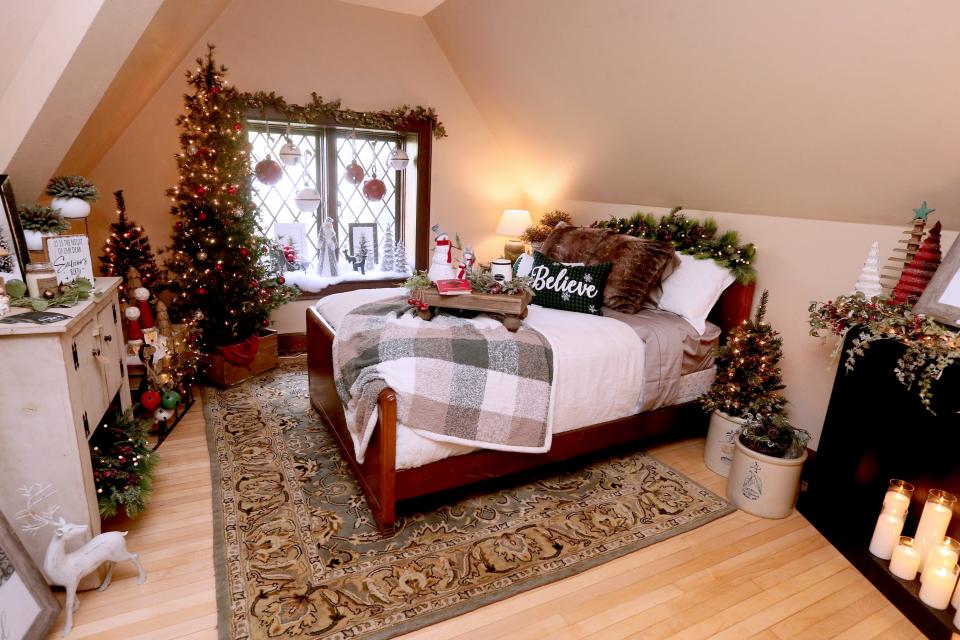 Alicia Dineen and Mary Windall decorated a third-floor bedroom with a theme Dineen called “A Cozy Cottage Christmas.” Dineen and Windall are the owners of A Conversation Piece, a home decor store in West Bend.