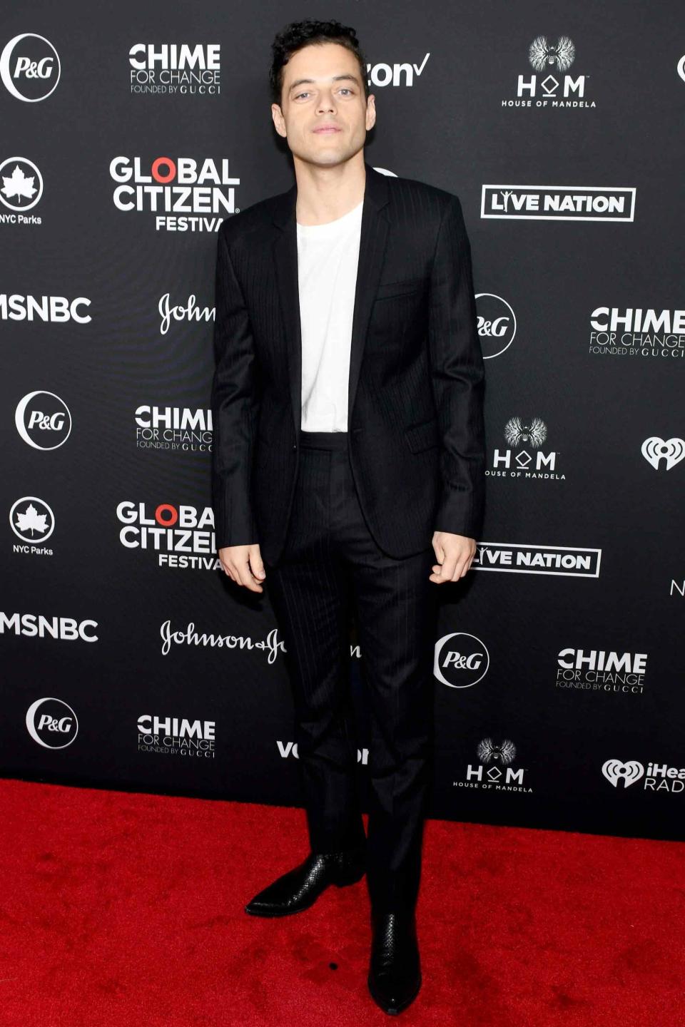Rami Malek knows the power of the perfect black suit.