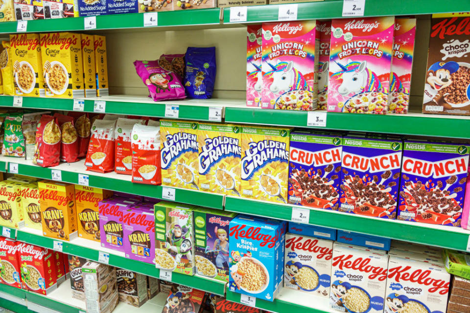 A cereal aisle at a grocery store.