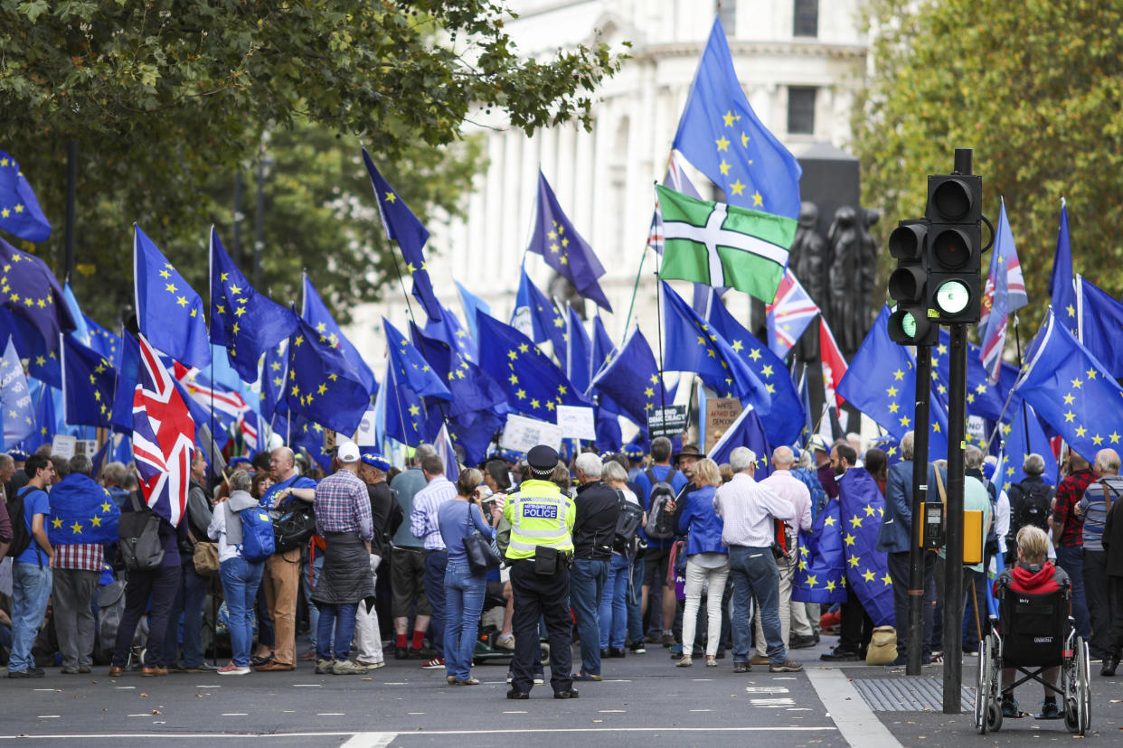 Anti Brexit demonstrators attend a protest at Parliament Square in London, Tuesday, Sept. 3, 2019. Lawmakers returned from their summer recess Tuesday for a pivotal day in British politics as they challenged Prime Minister Boris Johnson's insistence that the U.K. leave the European Union on Oct. 31, even without a withdrawal agreement to cushion the economic blow. (AP Photo/Vudi Xhymshiti)