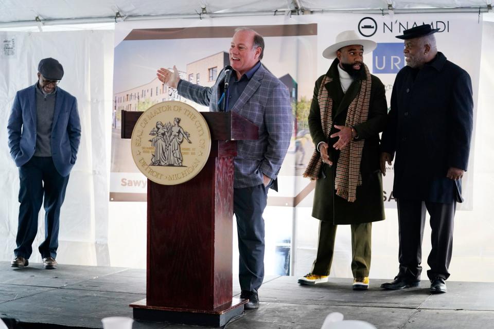 Developers Richard Hosey of Hosey Development, left, and Detroit Mayor Mike Duggan break ground on Dec. 7, 2021, with Rod Hardamon of URGE Development Group and George N'Namdi of N'Namdi Holdings, on the Sawyer Art Apartments on West McNichols in Detroit. The apartments will be available for lower-income tenants and will have 38 apartments that range from studio, one and two bedrooms. Duggan said this group is the "dream team" of local development.