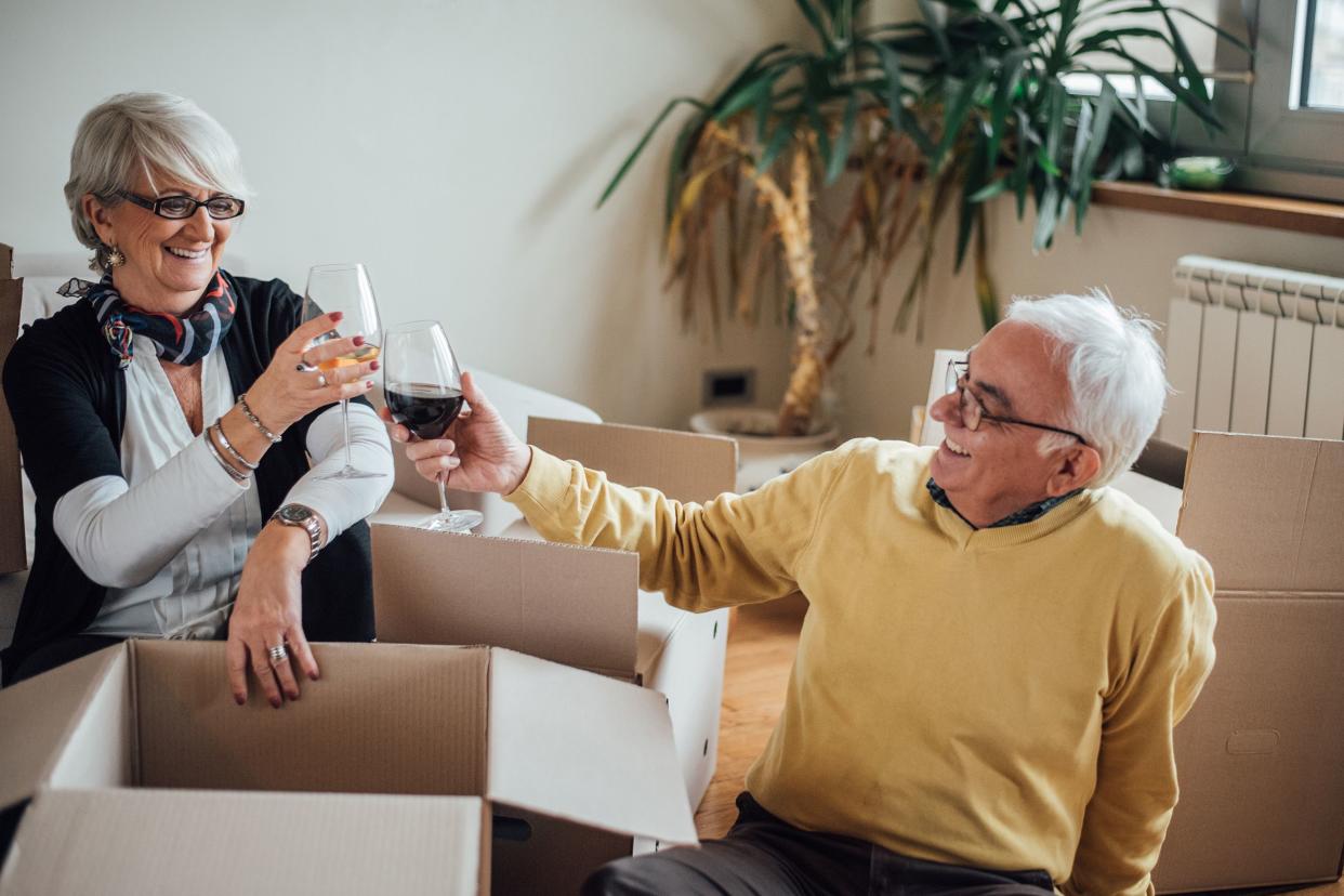 happy elderly couple moving to new apartment