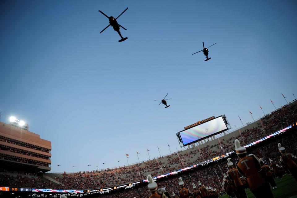 Army Black Hawk helicopters pass overhead during a game at Neyland Stadium on Sept. 2.