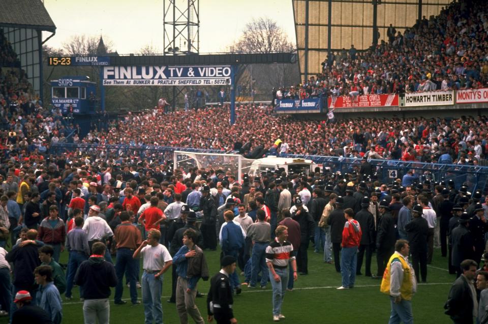 Supporters are crushed against the barrier as disaster strikes before the FA Cup semi-final match between Liverpool and Nottingham Forest played at the Hillsborough Stadium in Sheffield, England. (David  Cannon/Allsport)