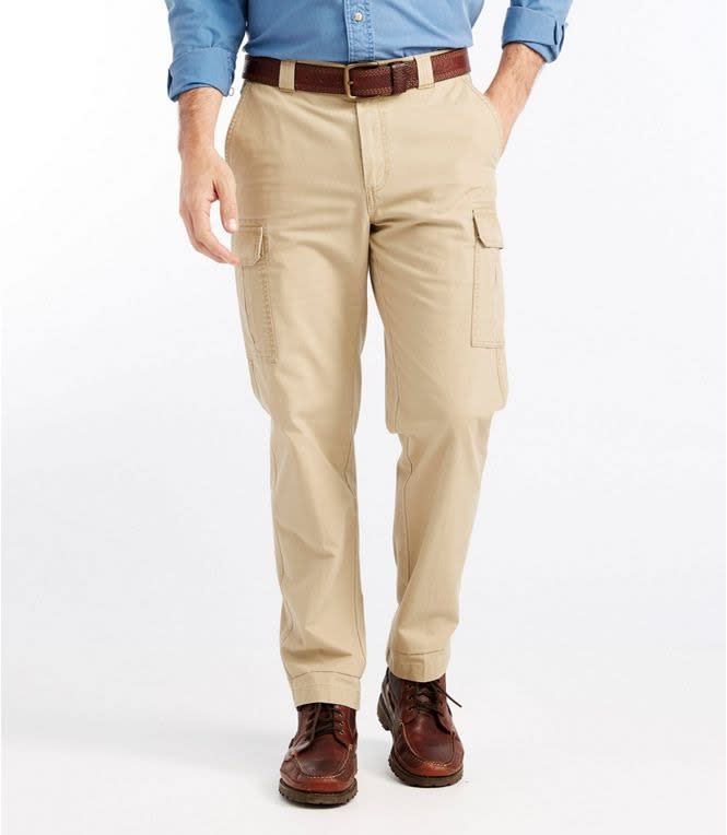 beige ll bean tropic weight cargo pants worn with a brown belt and shoes