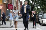 New York City Democratic mayoral candidate Bill di Blasio and his wife Chirlane McCray arrive to vote in the Democratic primary election in the Brooklyn borough of New York, September 10, 2013. (REUTERS/Brendan McDermid)