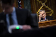 Chairman Mike Crapo, R-Idaho, listens as Federal Reserve Chair Jerome Powell and Treasury Secretary Steven Mnuchin, not pictured, testify during a Senate Banking Committee hearing on Capitol Hill, on Tuesday, Dec. 1, 2020, in Washington. (Al Drago/The New York Times via AP, Pool)