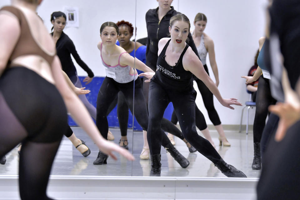 Amarisa LeBar, right front, a Radio City Rockette, leads students in a Rockettes Precision Dance Technique course on Wednesday, Feb. 8, 2023, at the Boston Conservatory at Berklee in Boston. (AP Photo/Josh Reynolds)
