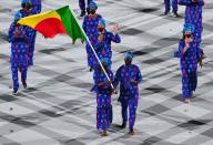 <p>Benin's flag bearer Nafissath Radji (L) and Benin's flag bearer Privel Hinkati lead the delegation during the opening ceremony of the Tokyo 2020 Olympic Games, at the Olympic Stadium, in Tokyo, on July 23, 2021. (Photo by Martin BUREAU / AFP) (Photo by MARTIN BUREAU/AFP via Getty Images)</p> 