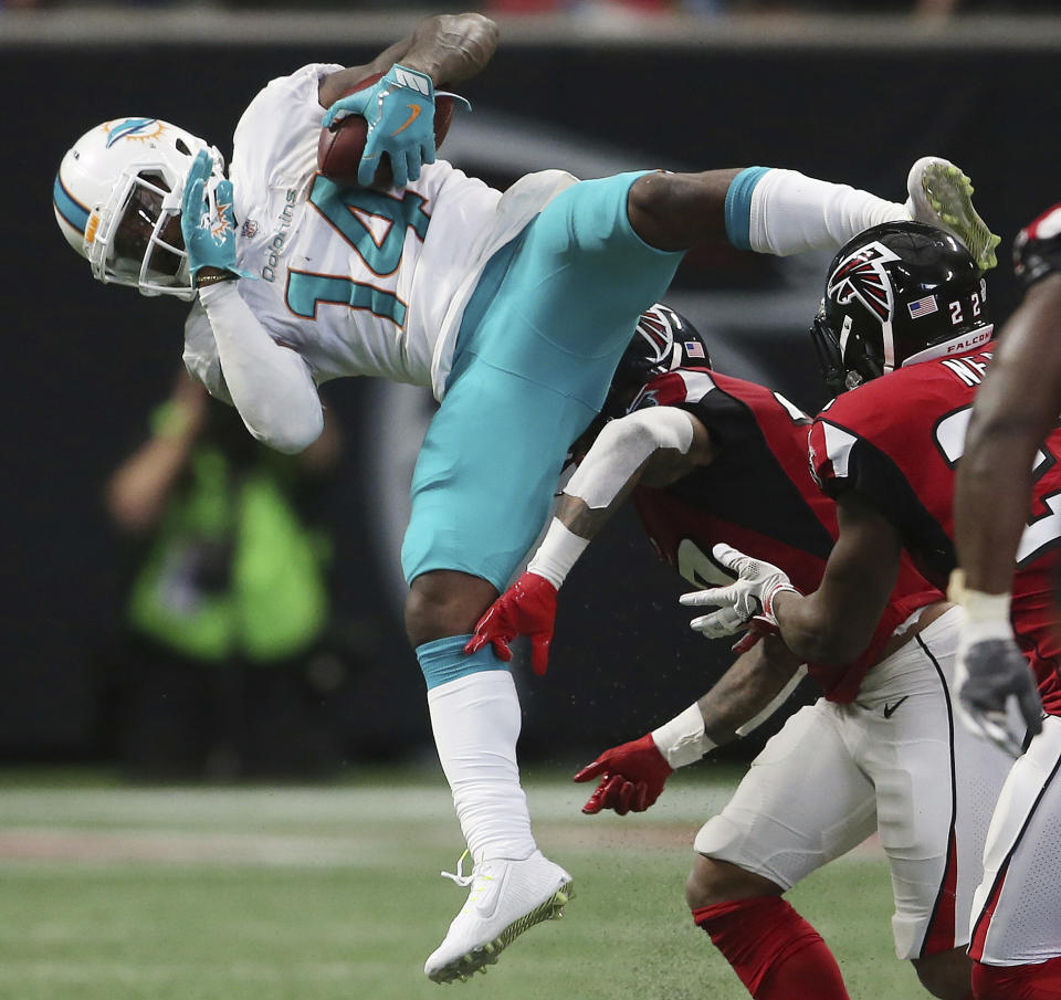 FILE - Miami Dolphins wide receiver Jarvis Landry (14) makes a first down catch against the Atlanta Falcons during the second half of an NFL football game, Sunday, Oct. 15, 2017, in Atlanta. Five-time Pro Bowl receiver Jarvis Landry is trying to get back in the league after sitting out last season. The 31-year-old Landry will take part in Jacksonville’s rookie minicamp May 10-11, a chance to prove he’s fully healthy following a nagging ankle injury in 2022. (AP Photo/John Bazemore, FIle)