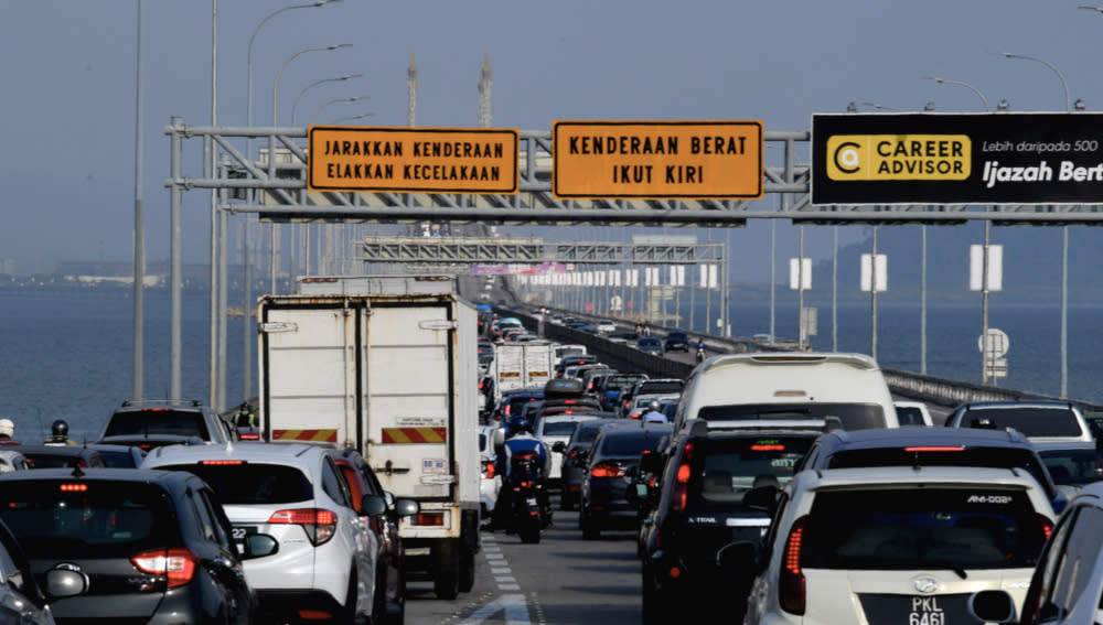 Traffic is at a standstill after a power cable under the Penang Bridge at KM3.2 caught fire in George Town, February 22, 2021. — Bernama pic