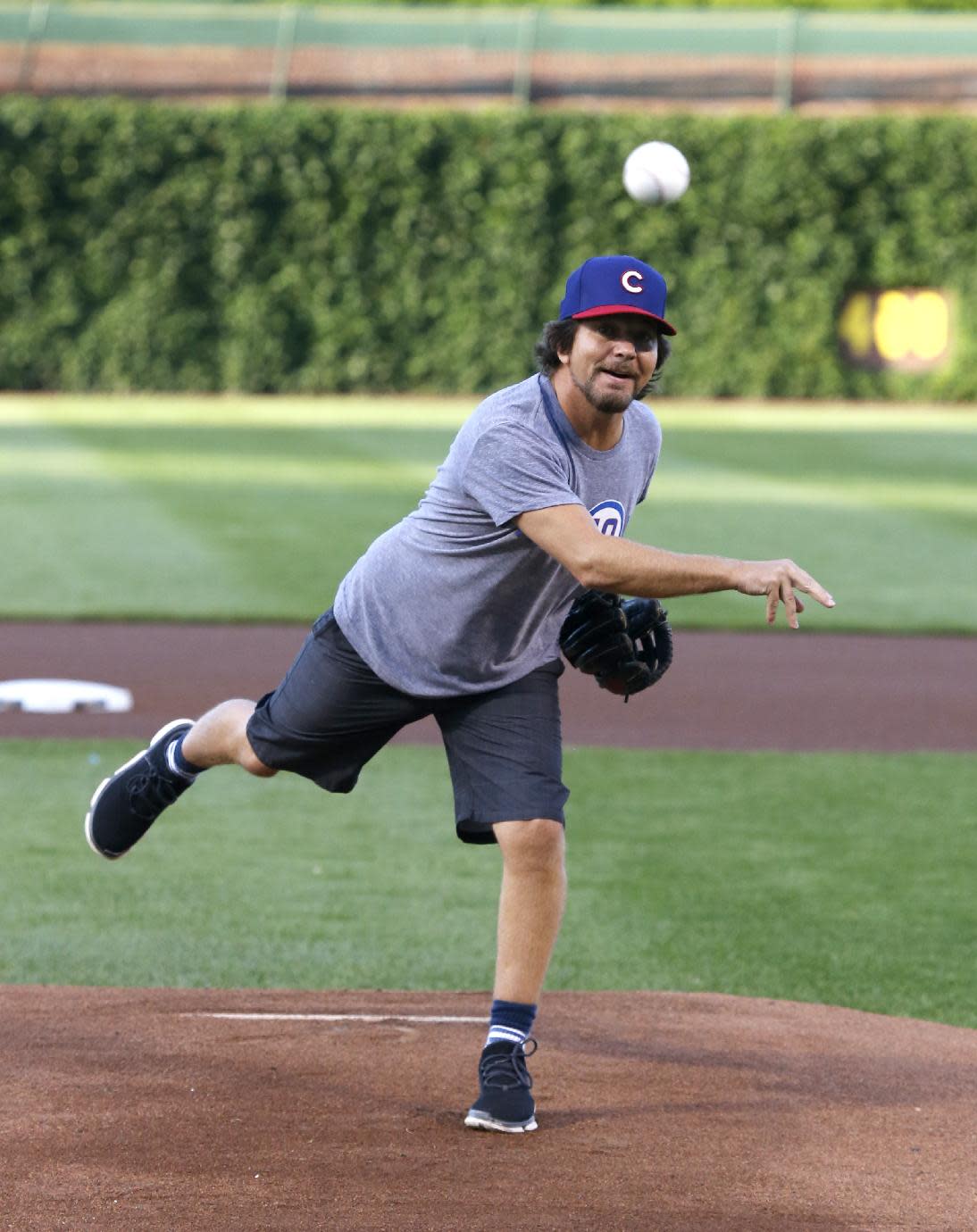Eddie Vedder wore a batting helmet to throw a first pitch for the