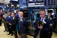 <p>Traders on the floor of the New York Stock Exchange, Tuesday, May 23, 2017, observe a moment of silence in the wake of the attack in Manchester, England. (AP Photo/Richard Drew) </p>