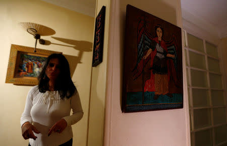 Maha Ragaay is seen near a religious portrait at her home in the Cairo suburb of Maadi, Egypt, April 14, 2017. REUTERS/Amr Abdallah Dalsh