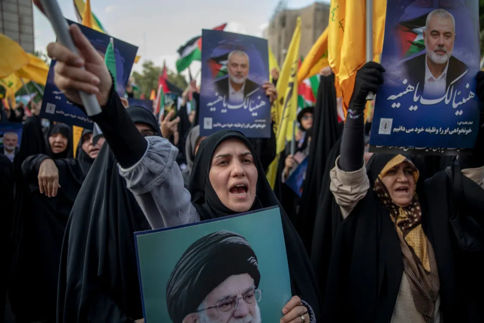 :Hundreds of protesting Iranians take part in a protest against the killing of Ismail Haniyeh, the political head of Hamas, in Palestine Square in Tehran, Iran, Wed. July 31, 2024. Haniyeh, the political head of Hamas, was killed in exile. In the air attack on Wednesday morning in the capital of Iran, Hamas political leader, Ismail Haniyeh, was killed in an airstrike in Tehran after attending the inauguration of Iran's new president. Israel has yet to claim responsibility for his death.