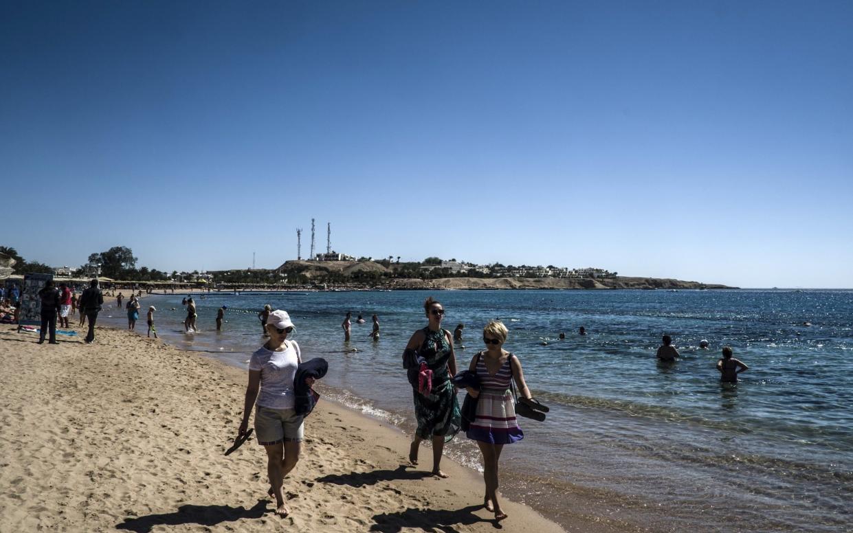 Tourists on the beach in Egypt's Red Sea resort of Sharm El Sheikh