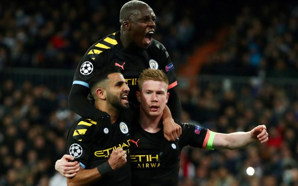 Manchester City's Kevin De Bruyne celebrates scoring their second goal with Riyad Mahrez and Benjamin Mendy. - REUTERS