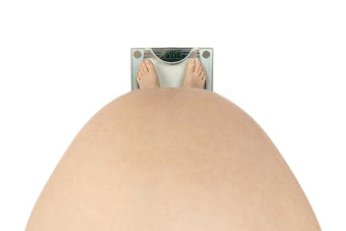   <span class="attribution"><a class="link " href="https://www.shutterstock.com/image-photo/pregnant-scales-stomach-feet-weight-round-97858217?src=HUsyiVtt5WC90XThBaLULQ-3-11" rel="nofollow noopener" target="_blank" data-ylk="slk:Shutterstock;elm:context_link;itc:0;sec:content-canvas">Shutterstock</a></span>