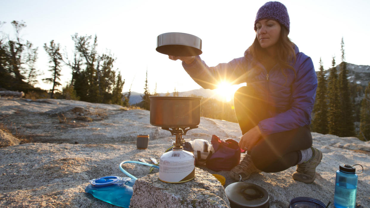  how to clean camping cookware: wild camper cooking on camping stove 