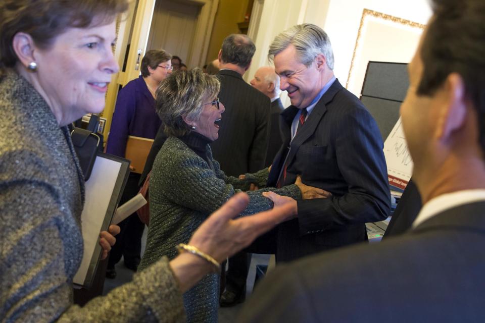 Senate Environment and Public Works Committee Chairman Sen. Barbara Boxer, D-Calif., talks with Sen. Sheldon Whitehouse, D-R.I., during a meeting of the Senate Climate Action Task Force prior to taking to the Senate Floor all night to urge action on climate change on Monday, March 10, 2014, in Washington. At left is Sen. Jeanne Shaheen, D-N.H. (AP Photo/ Evan Vucci)