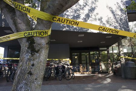 Police tape is seen at the scene of the previous day's shooting at Otto Miller Hall at Seattle Pacific University in Seattle, Washington June 6, 2014. REUTERS/David Ryder
