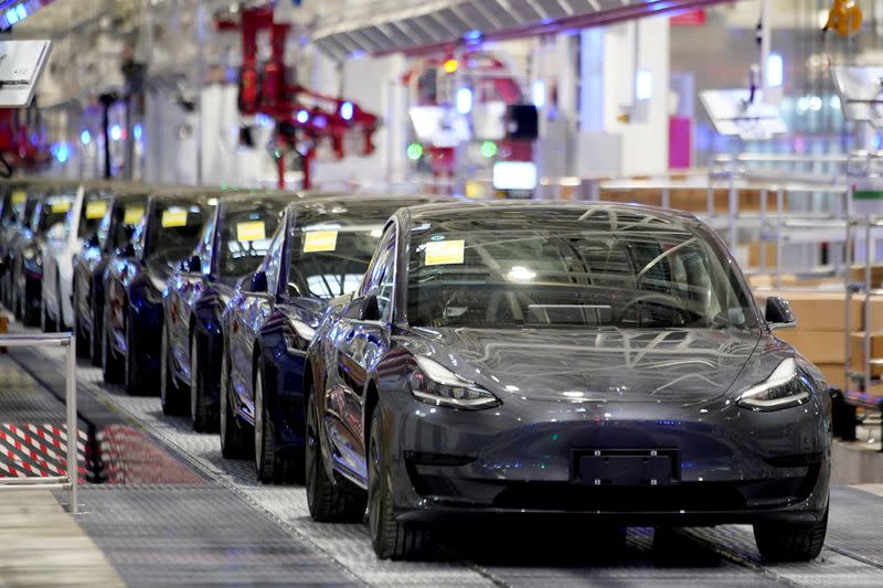 Tesla China-made Model 3 vehicles are seen during a delivery event at its factory in Shanghai