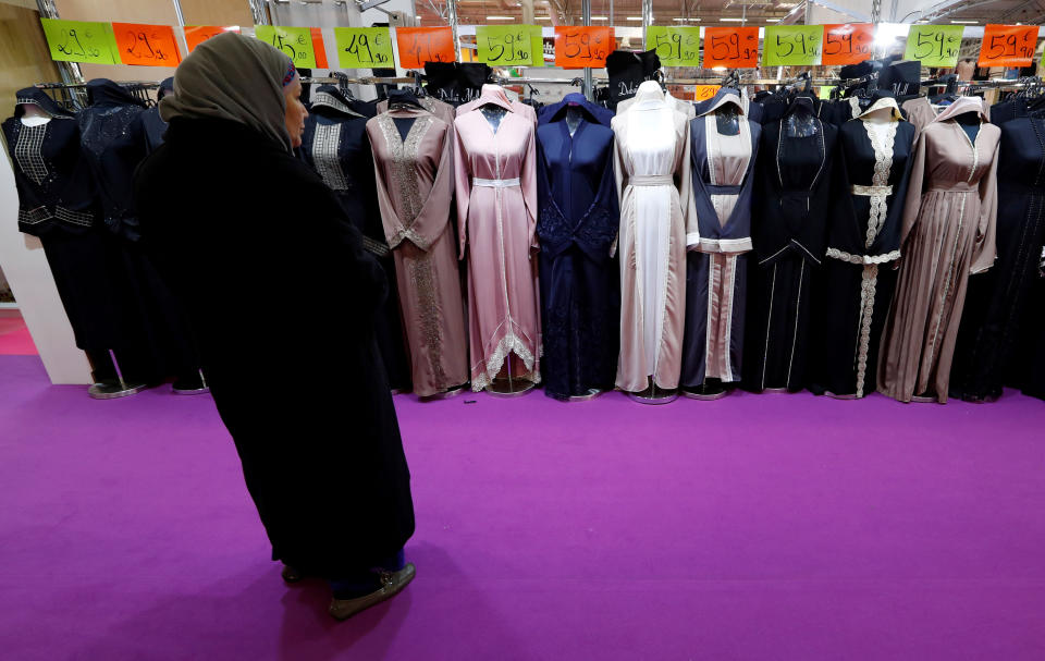 A visitor looks at women's clothes during a meeting organized by the Union of Islamic Organizations of France at Le Bourget, near Paris, in March 2018.&nbsp; (Photo: Gonzalo Fuentes / Reuters)