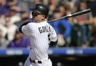 <p>Colorado Rockies’ Carlos Gonzalez follows the flight of his two-run home run off San Francisco Giants relief pitcher Josh Osich in the seventh inning of a baseball game Saturday, May 28, 2016, in Denver. <em>(AP Photo/David Zalubowski)</em> </p>