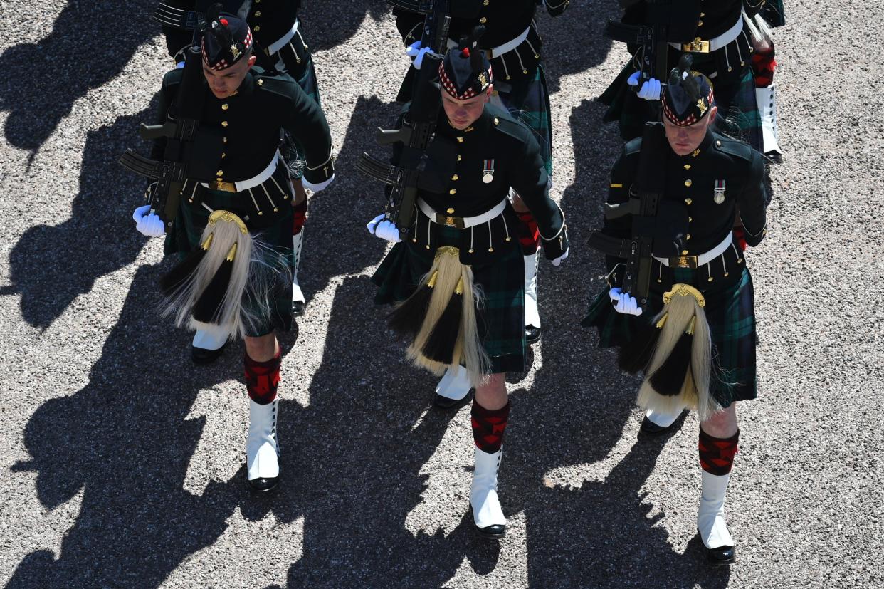 Military personnel march into the Quadrangle at Windsor Castle in Windsor, England Saturday, April 17, 2021, ahead of the funeral of Britain's Prince Philip.