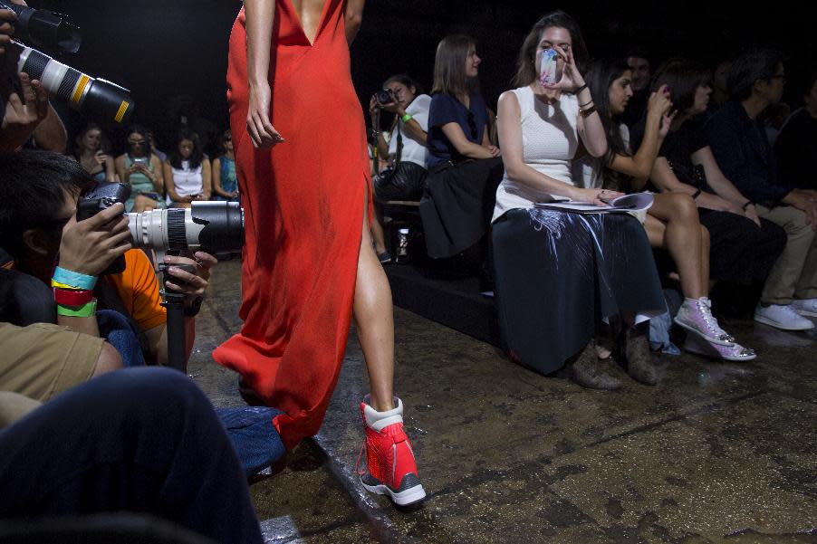 The DKNY Spring 2014 collection is modeled during Fashion Week in New York, Sunday, Sept. 8, 2013. (AP Photo/Craig Ruttle)