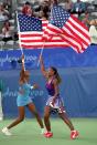 <p>Venus and Serena Williams of the USA celebrate gold after winning the Womens Doubles Tennis Final at the NSW Tennis Centre on Day 13 of the Sydney 2000 Olympic Games in Sydney, Australia. Mandatory Credit: Gary M Prior/Allsport </p>