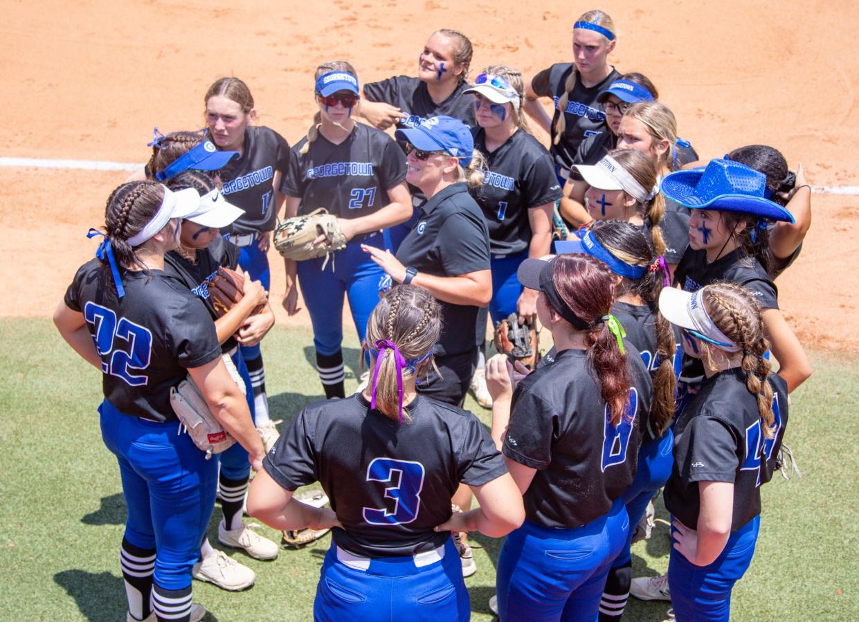 Georgetown coach Melissa Hall, center, talks to her team before its Class 5A state semifinal win over Aledo at McCombs Field. The Eagles have made back-to-back state tournament appearances.