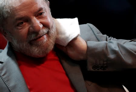 Former Brazilian President Luiz Inacio Lula da Silva reacts during a joint rally organized by left-wing political parties in Rio de Janeiro