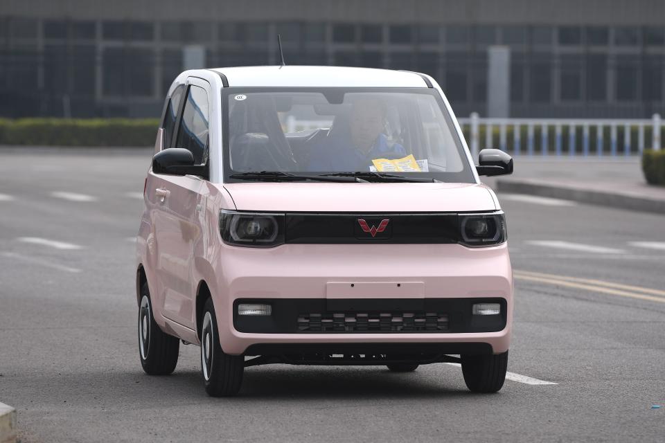 QINGDAO, CHINA - MARCH 30: A Wuling Hongguang Mini EV Macaron microcar rolls off the assembly line at a branch of SAIC-GM-Wuling Automobile on March 30, 2022 in Qingdao, Shandong Province of China. (Photo by Yu Fangping/VCG via Getty Images)