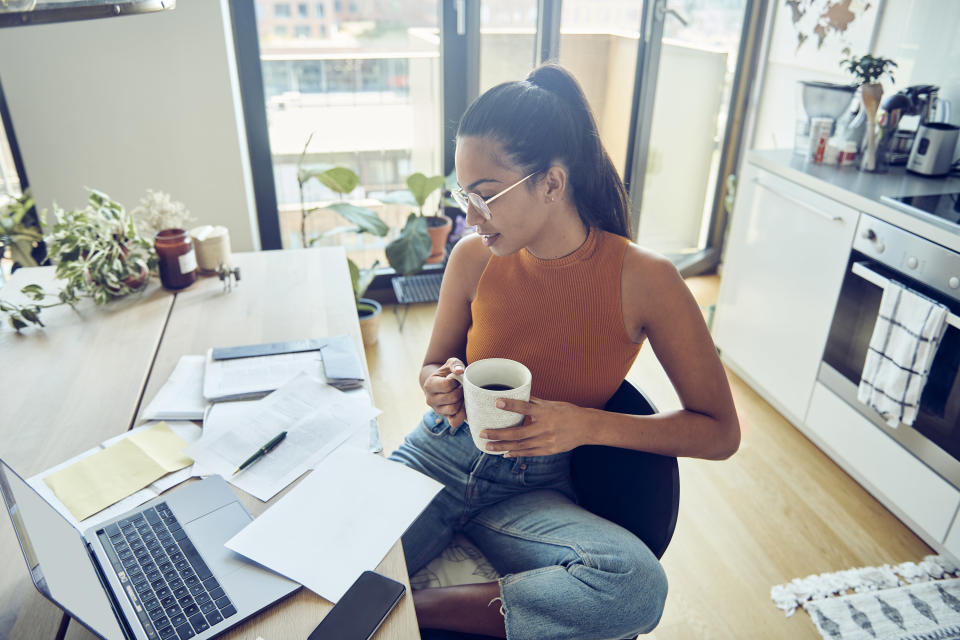 Woman looking over her finances at home