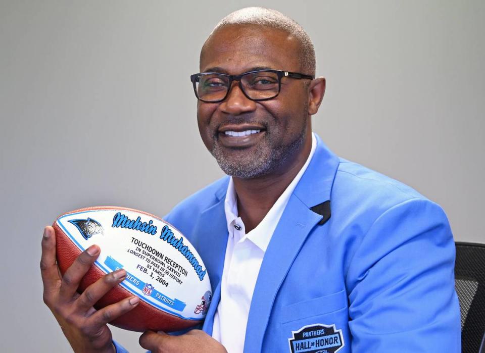 Former Carolina Panthers wide receiver Muhsin Muhammad holds the football he caught for the longest touchdown pass reception in Super Bowl history. The pass from quarterback Jake Delhomme resulted in an 85-yard touchdown.