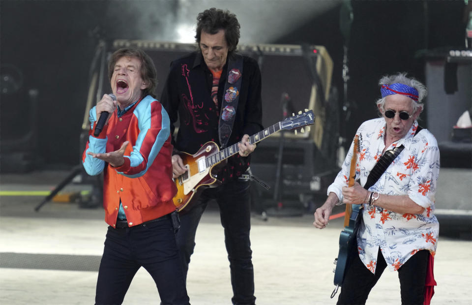 FILE - Mick Jagger, left, Ronnie Wood, center, and Keith Richards, right, of the band The Rolling Stones, perform during the last concert of their "Sixty" European tour, Aug. 3, 2022, in Berlin, Germany. On Tuesday, Nov. 21, 2023, the legendary English band announced that they're taking “Hackney Diamonds,” their first album of original material in 18 years, on the road. (AP Photo/Michael Sohn, File)