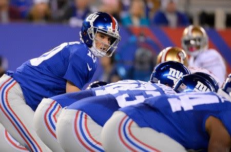 Oct 11, 2015; East Rutherford, NJ, USA; New York Giants quarterback Eli Manning (10) prepares for a snap during the first quarter against the San Francisco 49ers at MetLife Stadium. Mandatory Credit: Robert Deutsch-USA TODAY Sports