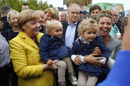 German Chancellor Angela Merkel visits harvest festival in Lauterbach, Germany, September 23, 2017. REUTERS/Axel Schmidt