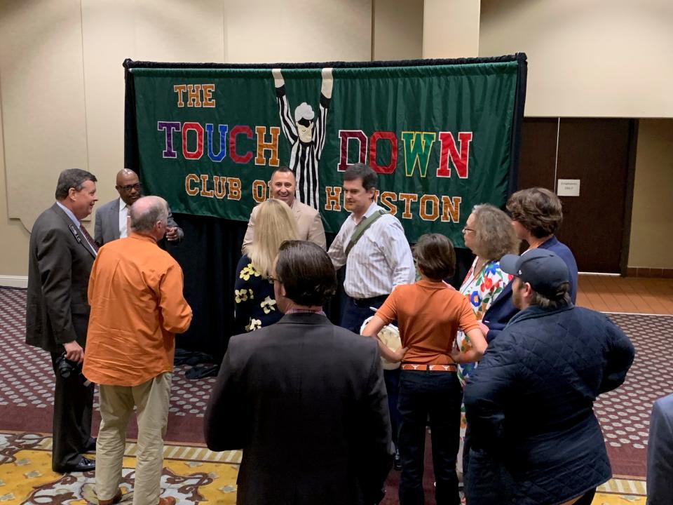 Texas coach Steve Sarkisian (center) greets fans at the Houston Touchdown Club event on Wednesday.