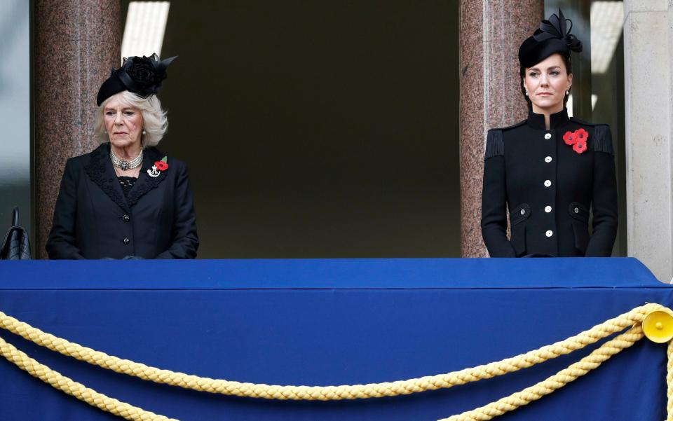 Camilla, the Duchess of Cornwall and Kate, the Duchess of Cambridge watch from a balcony at the Foreign Office -  Pool Reuters