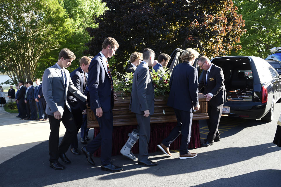 The casket of Riley Howell is carried by pall bearers to a hearse after his memorial service in Lake Junaluska, N.C., Sunday, May 5, 2019. Family, hundreds of friends and a military honor guard on Sunday remembered Howell, a North Carolina college student credited with saving classmates by rushing a gunman firing inside their lecture hall. (AP Photo/Kathy Kmonicek)