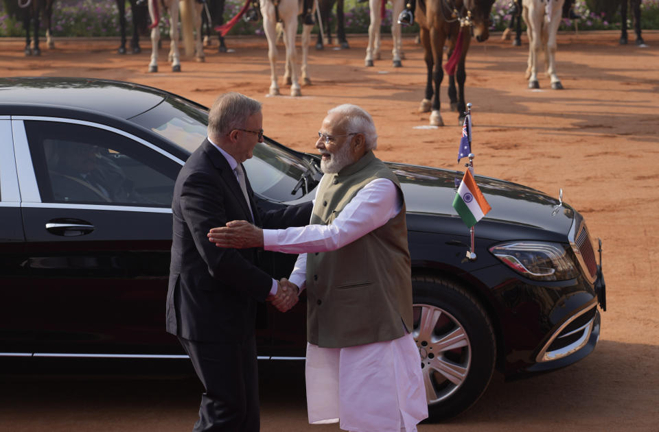 Indian Prime Minister Narendra Modi welcomes his Australian counterpart Anthony Albanese during laters's ceremonial reception at the Indian presidential palace, in New Delhi, India, Friday, March 10, 2023. Australia is striving to strengthen security cooperation with India and also deepen economic and cultural ties, Prime Minister Anthony Albanese said on Friday. (AP Photo/Manish Swarup)